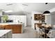 Modern kitchen with marble island, stainless steel appliances, and bright dining area at 6301 E Exeter Blvd, Scottsdale, AZ 85251