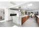 Bright, modern kitchen with marble island, stainless steel appliances and dining area at 6301 E Exeter Blvd, Scottsdale, AZ 85251