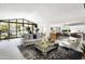 Open concept living room with stylish furnishings and view of pool at 6301 E Exeter Blvd, Scottsdale, AZ 85251