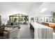 Open living space with modern kitchen, island seating and natural light at 6301 E Exeter Blvd, Scottsdale, AZ 85251