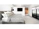 Spacious primary bedroom featuring a king-size bed, large windows, and a private entry at 6301 E Exeter Blvd, Scottsdale, AZ 85251
