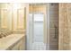 Bathroom featuring a sink with a tile countertop and a glass enclosed shower at 6701 N Scottsdale Rd # 23, Scottsdale, AZ 85250