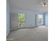 Bedroom featuring blue walls, carpet floors, and large windows with lots of light at 6701 N Scottsdale Rd # 23, Scottsdale, AZ 85250