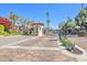 Gated community entrance featuring meticulous brick paving, lush landscaping and controlled access at 6701 N Scottsdale Rd # 23, Scottsdale, AZ 85250