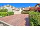 Spacious driveway leading to a two-car garage, surrounded by mature landscaping at 6701 N Scottsdale Rd # 23, Scottsdale, AZ 85250