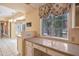Kitchen featuring granite countertops, built-in cabinets, and view to the backyard at 6701 N Scottsdale Rd # 23, Scottsdale, AZ 85250