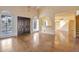 Bright living room showcasing high ceilings, wood floors, and arched doorways to other spaces at 6701 N Scottsdale Rd # 23, Scottsdale, AZ 85250