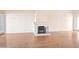 Spacious living room features a fireplace, hardwood floors, and bright natural light at 6701 N Scottsdale Rd # 23, Scottsdale, AZ 85250