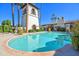 Resort-style pool with palm trees and a tower, perfect for relaxing and enjoying the outdoors at 6701 N Scottsdale Rd # 23, Scottsdale, AZ 85250