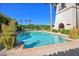 Inviting community pool with clear water, surrounded by lush landscaping and a charming tower at 6701 N Scottsdale Rd # 23, Scottsdale, AZ 85250