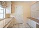 Bright room featuring granite countertops, built-in cabinets, and access to the backyard at 6701 N Scottsdale Rd # 23, Scottsdale, AZ 85250