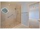 Beautifully tiled shower with a unique window, grab bar, and access to the adjoining bedroom at 6701 N Scottsdale Rd # 23, Scottsdale, AZ 85250