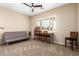 Multi-purpose bonus room featuring a ceiling fan and flexible seating/desk arrangements at 6777 S Four Peaks Way, Chandler, AZ 85249