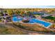 Aerial view of the community pool with various seating areas and mature landscaping at 6777 S Four Peaks Way, Chandler, AZ 85249