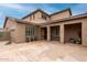 Spacious two-story home with ample outdoor space, showcasing architectural details and a welcoming entryway at 6844 W Mazatzal Dr, Peoria, AZ 85383