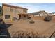 Large backyard with a covered patio and ample space for outdoor activities at 8613 S 49Th Dr, Laveen, AZ 85339