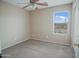 Bedroom with carpet, a ceiling fan, and a window with blinds at 8613 S 49Th Dr, Laveen, AZ 85339