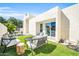 Inviting backyard features modern furniture, lush artificial grass, and a charming patio area, perfect for outdoor entertaining at 930 S Dobson Rd # 41, Mesa, AZ 85202