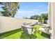 Secluded backyard offers ample seating, green artificial grass, and a dining area for outdoor enjoyment at 930 S Dobson Rd # 41, Mesa, AZ 85202
