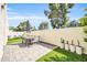 Inviting backyard provides both artificial grass and paved patio, including a dining area, perfect for entertaining and relaxing at 930 S Dobson Rd # 41, Mesa, AZ 85202