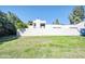 Home with a spacious grassy backyard surrounded by lush trees at 930 S Dobson Rd # 41, Mesa, AZ 85202