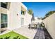 Backyard area with pavers and artificial grass includes outdoor seating and dining, perfect for entertaining guests at 930 S Dobson Rd # 41, Mesa, AZ 85202