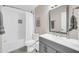 Clean bathroom featuring white tiled shower/tub and a gray vanity with modern fixtures at 930 S Dobson Rd # 41, Mesa, AZ 85202