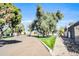 Picturesque street view with mature trees, manicured lawns, and well-maintained roads under a bright, sunny sky at 930 S Dobson Rd # 41, Mesa, AZ 85202