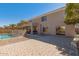 Backyard features a covered patio, BBQ, brick pavers, gravel and a fenced pool at 9426 E Los Lagos Vista Ave, Mesa, AZ 85209