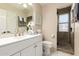 Modern bathroom features a white vanity, updated fixtures, and a tiled shower at 9426 E Los Lagos Vista Ave, Mesa, AZ 85209