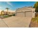 Large two car garage with extended drive and desert landscaping at 9426 E Los Lagos Vista Ave, Mesa, AZ 85209