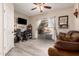 Cozy living room with access to outdoor patio, features comfortable seating and decor at 9426 E Los Lagos Vista Ave, Mesa, AZ 85209