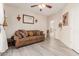 Comfortable living room with sofa and hardwood floors at 9426 E Los Lagos Vista Ave, Mesa, AZ 85209
