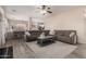 Comfortable living room features a large sectional sofa and a view into the kitchen area at 9426 E Los Lagos Vista Ave, Mesa, AZ 85209