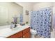 Bright bathroom featuring a vanity with sink, toilet and shower/tub combo at 9537 E Flint Dr, Gold Canyon, AZ 85118