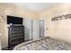 Comfortable bedroom featuring a dresser and a view of the hall closet at 9537 E Flint Dr, Gold Canyon, AZ 85118
