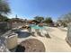 Community pool and sun deck with tables, chairs, and lounging options at 9537 E Flint Dr, Gold Canyon, AZ 85118