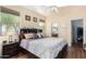 Serene main bedroom with a large bed, ceiling fan, and en-suite bathroom for ultimate relaxation at 9537 E Flint Dr, Gold Canyon, AZ 85118