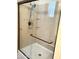 Close up of a clean walk-in shower featuring a bronze shower head and sleek glass door at 9537 E Flint Dr, Gold Canyon, AZ 85118