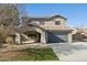 Two-story home with a spacious front yard, desert landscaping, covered porch and two car garage at 15934 W Banff Ln, Surprise, AZ 85379