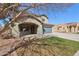 Attractive two-story home with desert landscaping and a covered entrance for parking at 15934 W Banff Ln, Surprise, AZ 85379