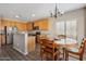 Eat-in kitchen with stainless steel appliances, granite counters, and light wood cabinetry at 15934 W Banff Ln, Surprise, AZ 85379