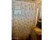 Bathroom with a shower and decorative curtain plus granite countertop and plenty of storage at 1621 N 38Th Dr, Phoenix, AZ 85009