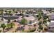 An aerial view of the home's exterior, showcasing desert landscaping and a private patio in a well-maintained community at 16464 W Una Noche Ct, Surprise, AZ 85374