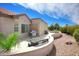 Beautiful backyard featuring a BBQ grill, comfortable seating, desert landscaping, and a relaxing atmosphere at 16464 W Una Noche Ct, Surprise, AZ 85374