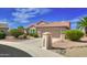 Charming single-Gathering home featuring desert landscaping, a tile roof, and an attached two-car garage at 16464 W Una Noche Ct, Surprise, AZ 85374