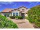 Charming single-Gathering home featuring well-maintained landscaping, a tile roof, and a private entrance at 16464 W Una Noche Ct, Surprise, AZ 85374