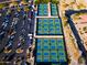 Aerial view of pickleball courts and parking lot in a vibrant community setting at 16464 W Una Noche Ct, Surprise, AZ 85374