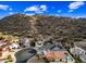 An aerial view shows the home and neighborhood backing up to the hills at 1723 E Behrend Dr, Phoenix, AZ 85024