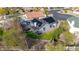 Aerial view of home with solar panels, covered patio, grassy yard and potential garden space at 1723 E Behrend Dr, Phoenix, AZ 85024